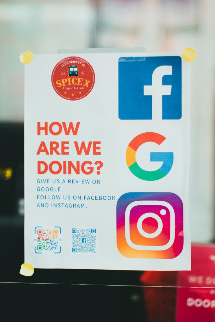A poster titled "How Are We Doing?" showcases logos for Facebook, Google, and Instagram. It urges you to get Google reviews for local SEO and follow us on social media. Featuring two QR codes at the bottom, the SpiceX Atlantic Canada logo shines at the top.